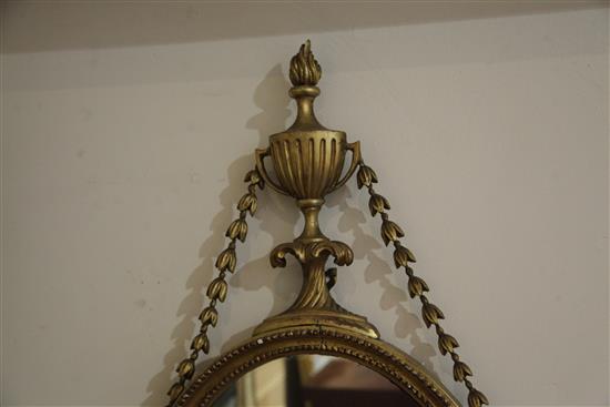 A pair of George III giltwood and gesso oval wall mirrors, W.1ft 5in. H.2ft 7.5in.